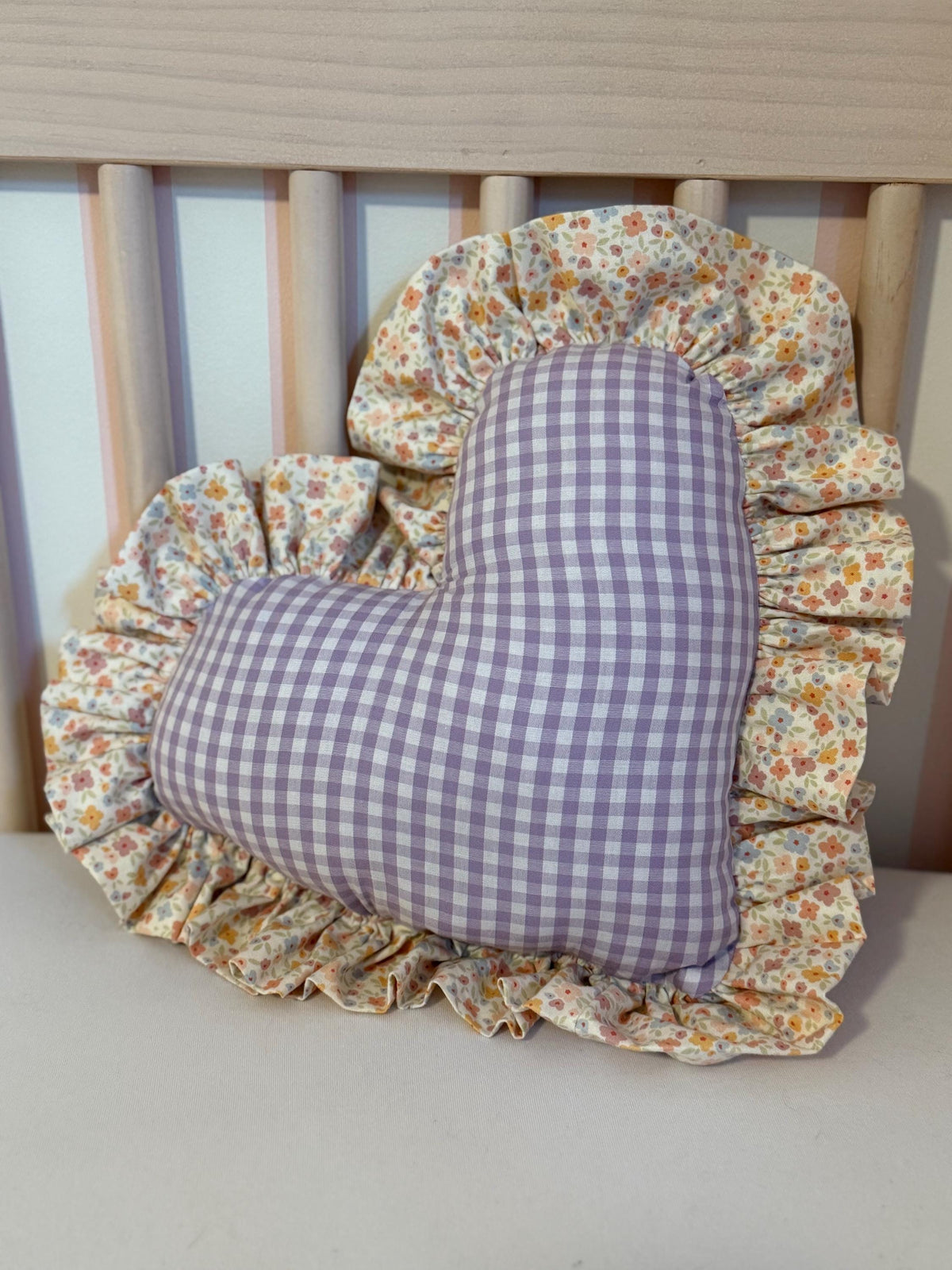 Purple gingham heart throw pillow with floral ruffle trim, full view