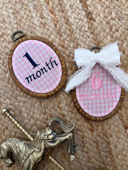 Oval milestone discs for '1 month' and '6 months' with gold horse accessory